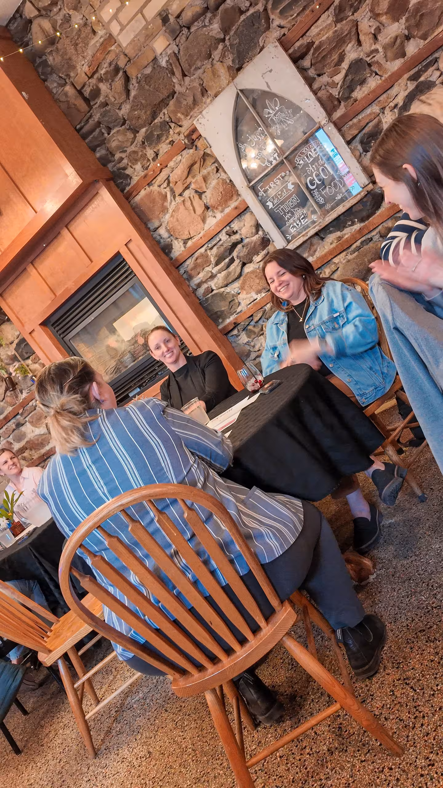 Woman speaking from a chair during a WOWSA cafe event.