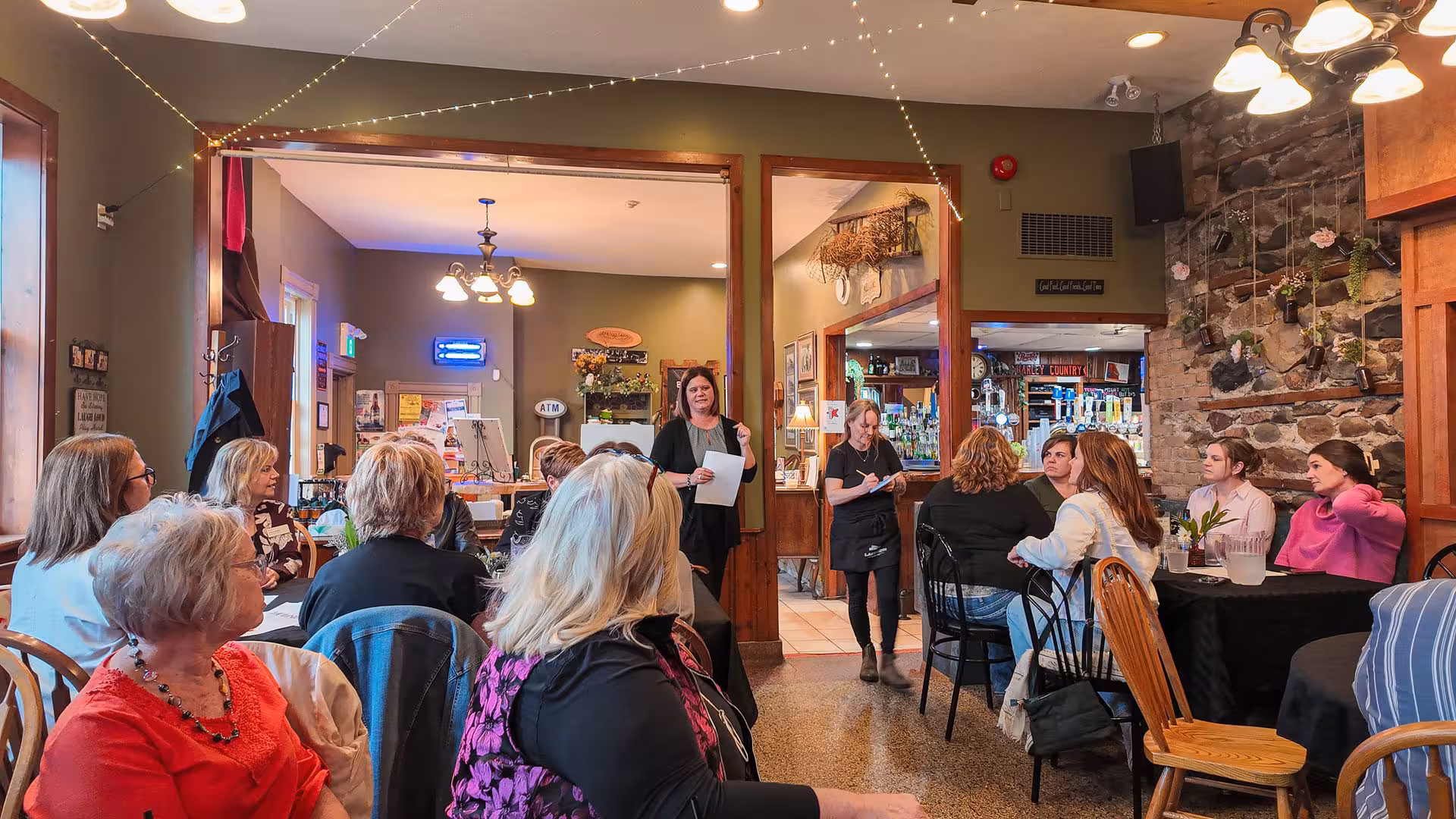 Speaker addressing a seated group at a WOWSA cafe event.
