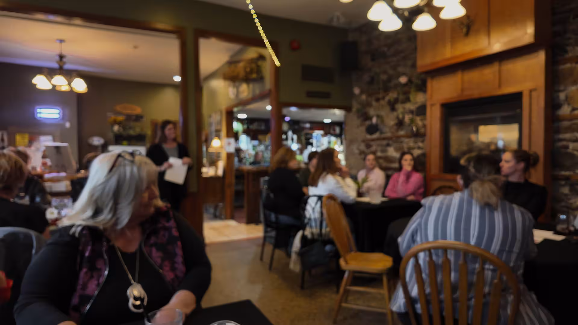 Women seated together during a WOWSA cafe event.