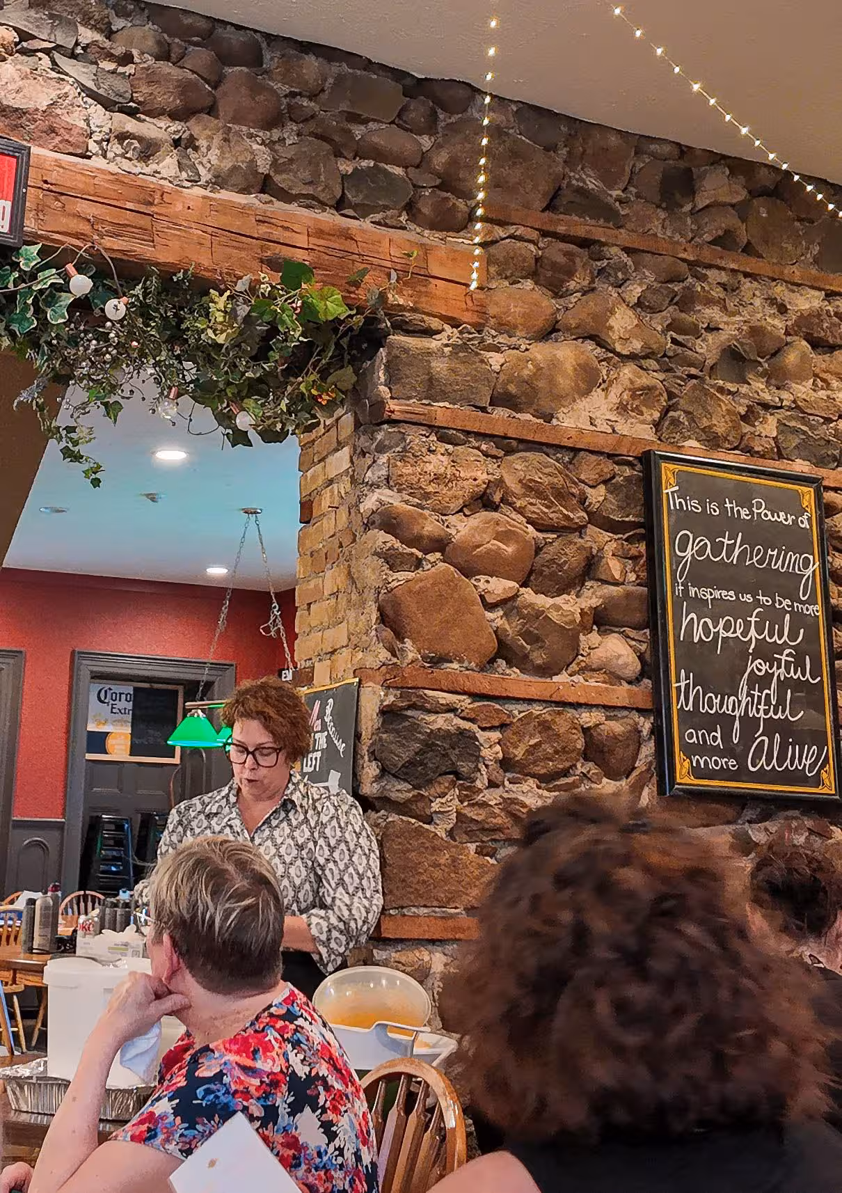 Woman speaking to a group at a WOWSA cafe event.