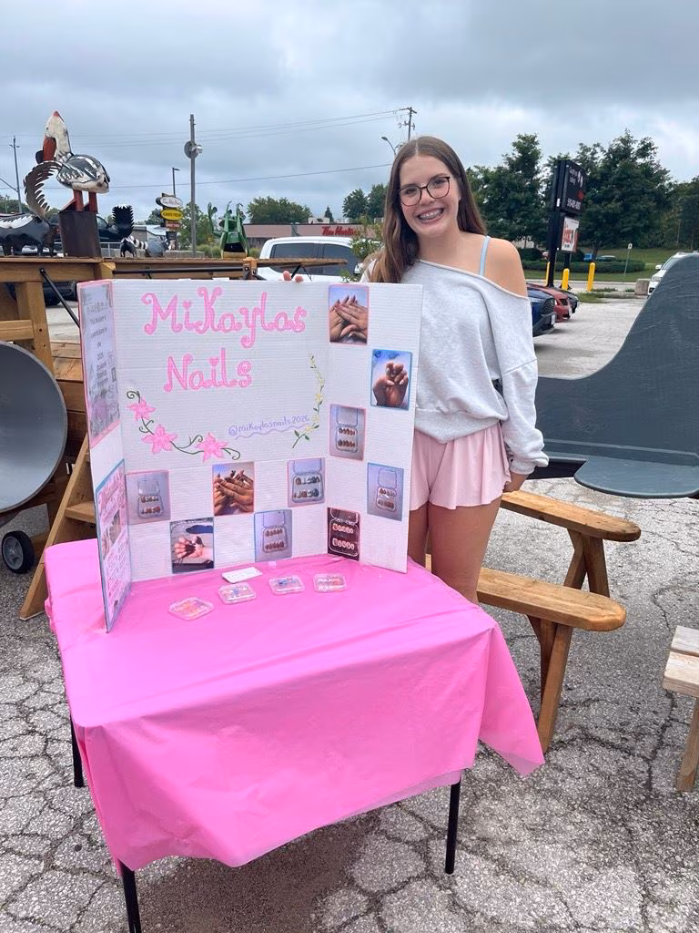 Mikayla's Nails display at a youth market.