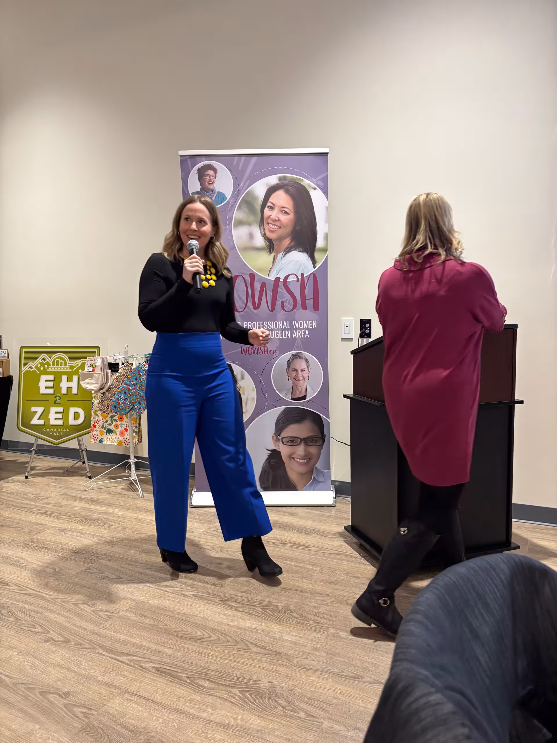Speaker presenting beside a WOWSA banner.