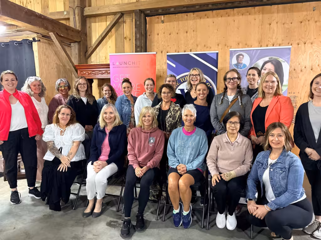Women posing for a group photo at a WOWSA event.