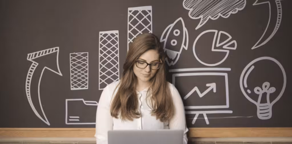 Businesswoman presenting ideas on a chalkboard.