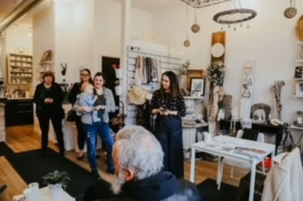 Group gathered inside a Wellington North shop.